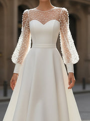 Elegant White Pearl Embellished A-Line Dress