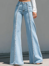 High-Waisted Light Blue Flared Jeans With Raw Edge Seams