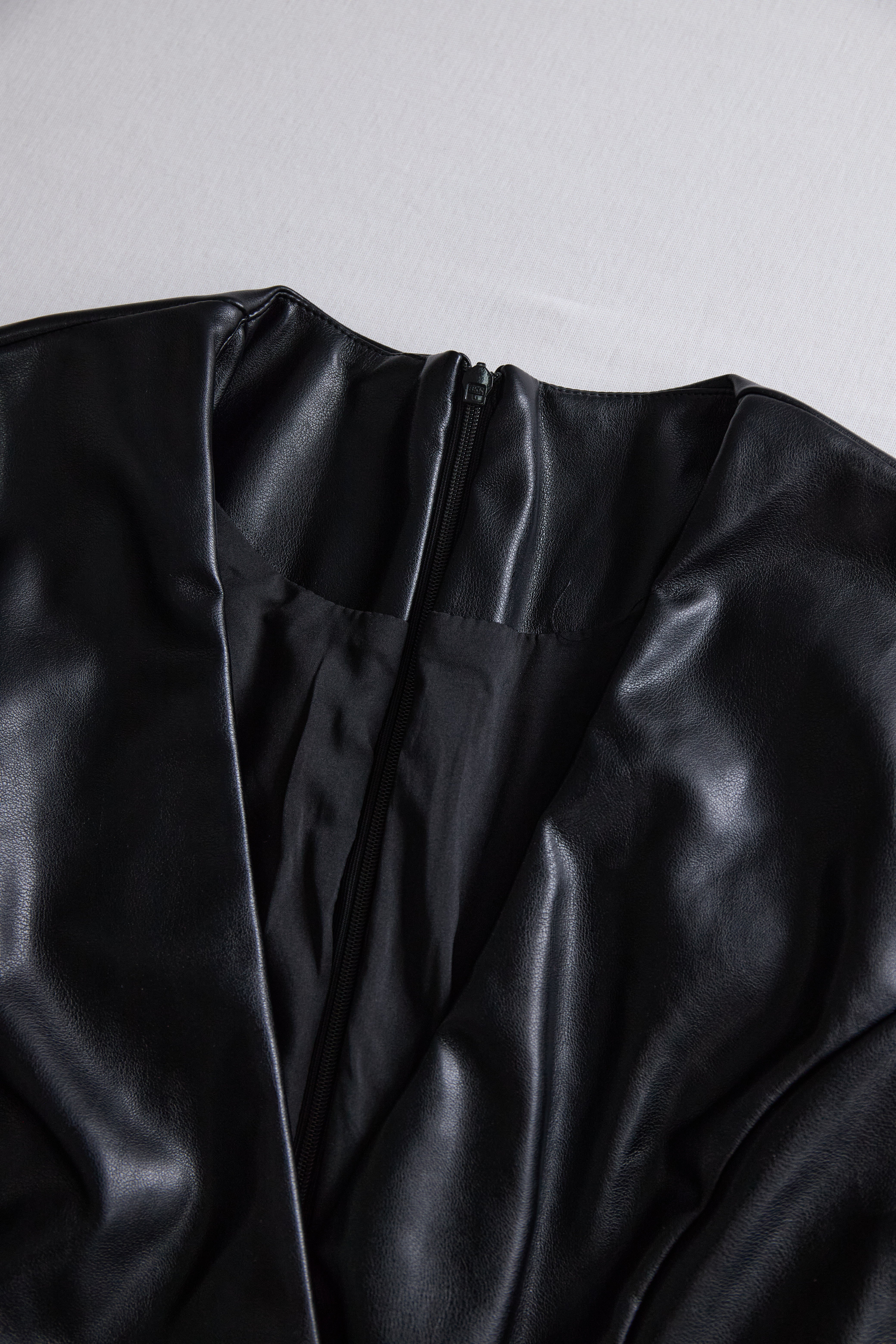 Sleek Black Faux Leather Wrap Mini Dress