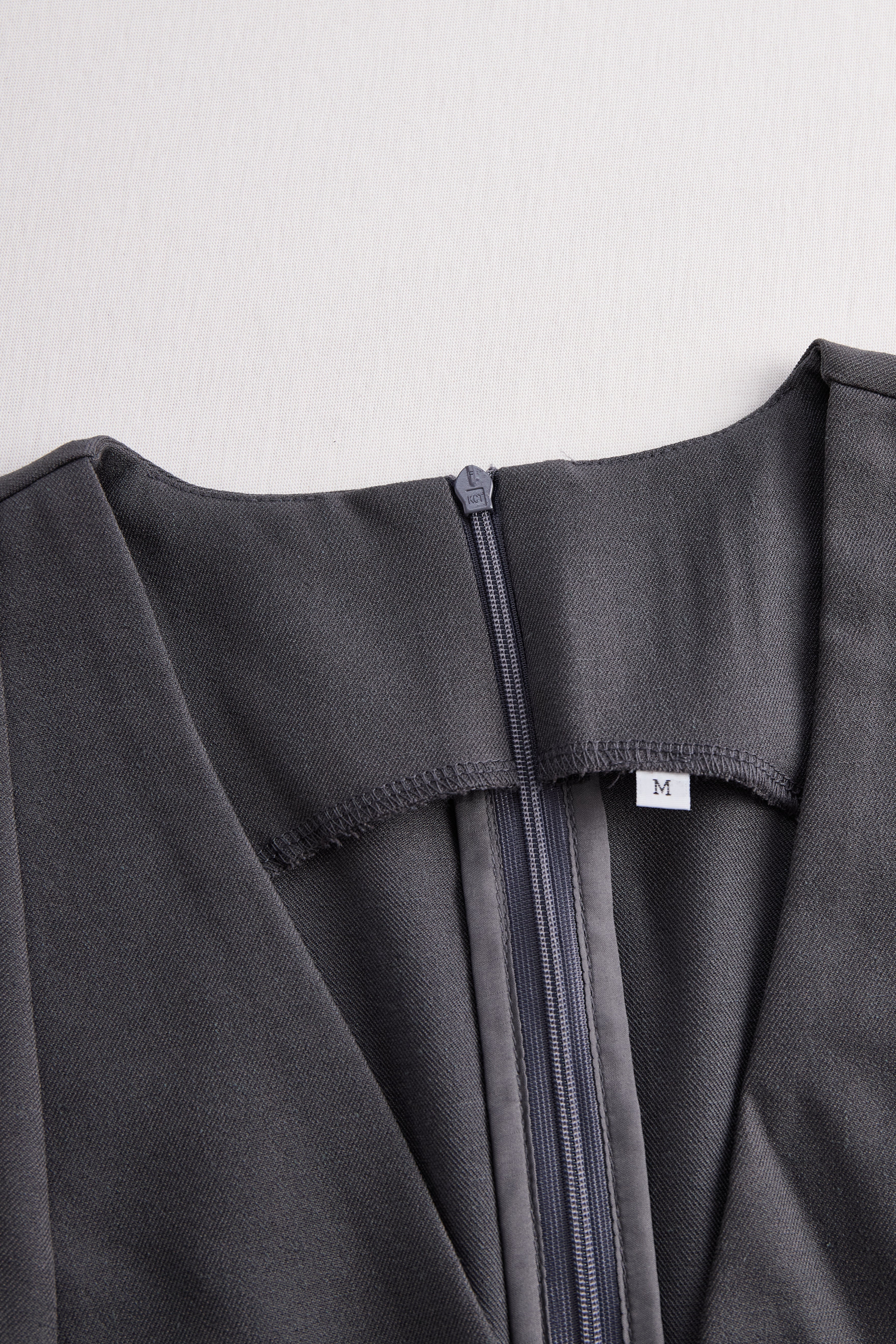 Sophisticated Sleeveless Peplum Jumpsuit In Charcoal Gray